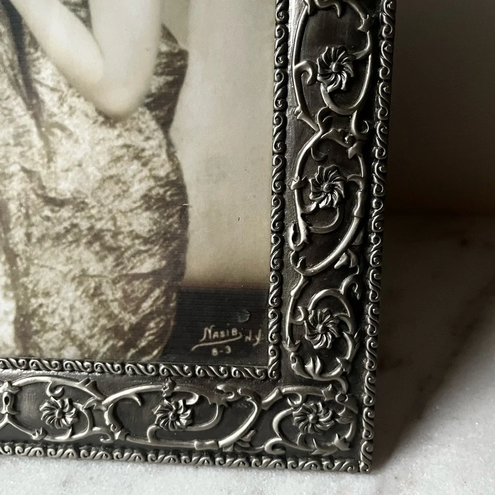 Large ornate silver Frame for photo 8”x10” free standing..